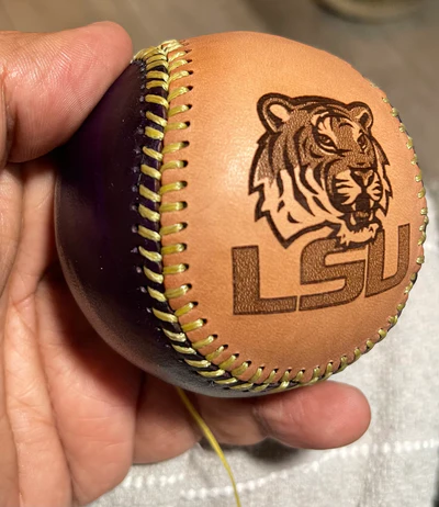 Custom baseball held in hand